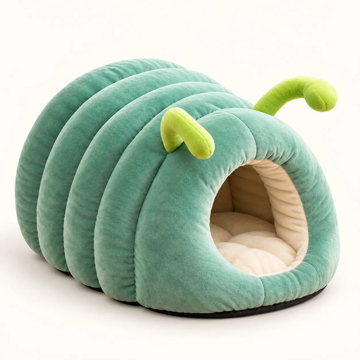 A green caterpillar-shaped plush pet bed with a segmented body, antennae, and a cream-colored interior, shown on a plain white background.